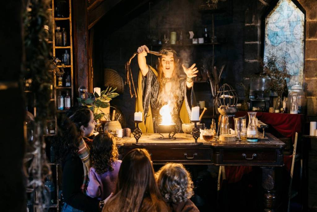 witch making potion at Kryal Castle in front of children