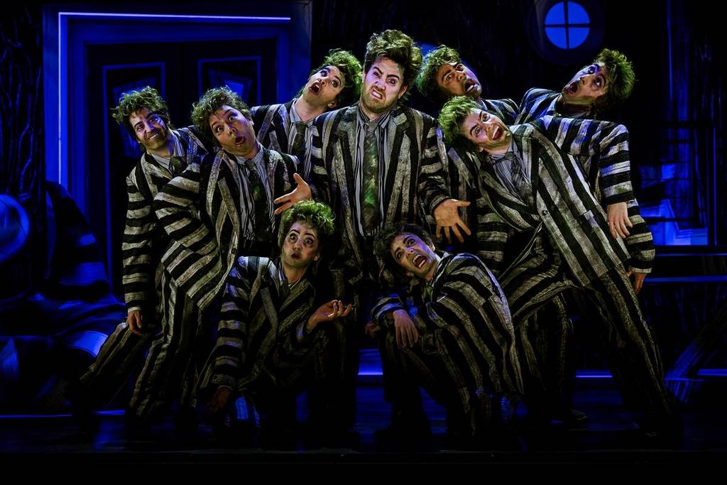 Beetlejuice surrounded by lookalikes