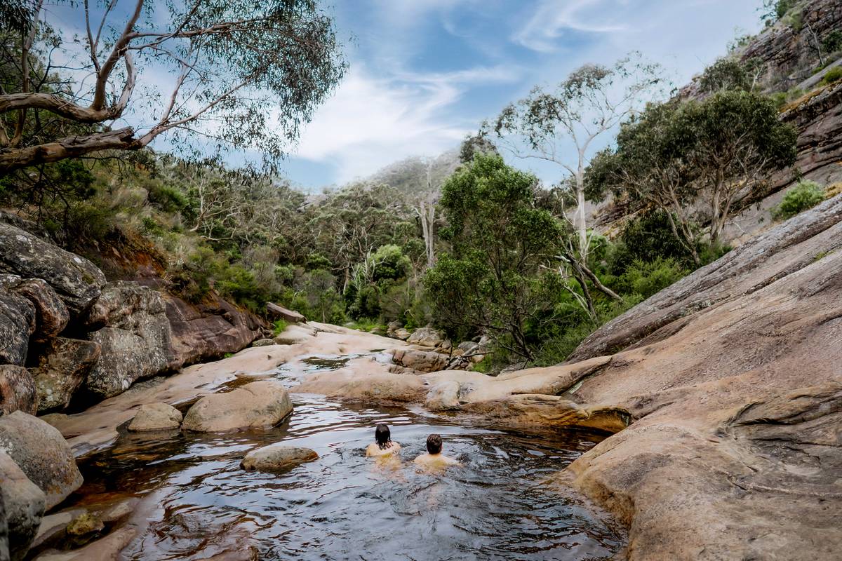 two people swimming in Venus Baths