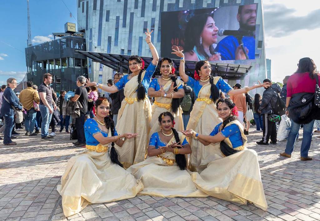 performers in cultural outfits posing at Fed Square for Diwali