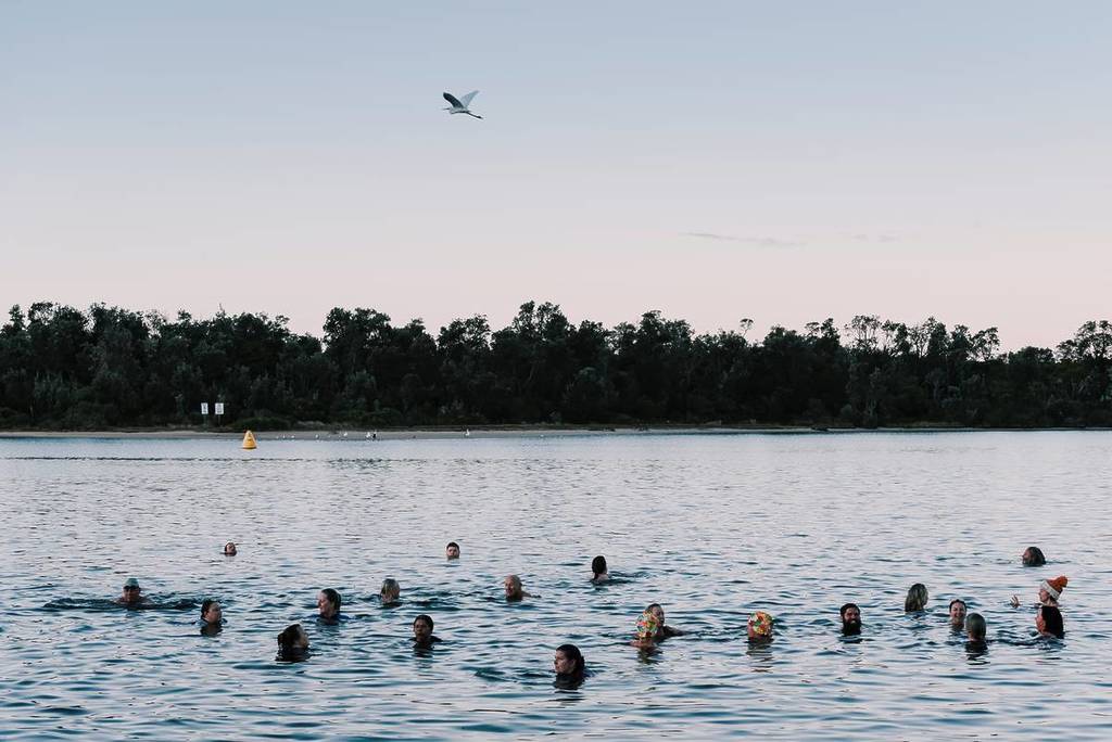 people swimming at sunrise during the solstice at the East Gippsland Winter Festival
