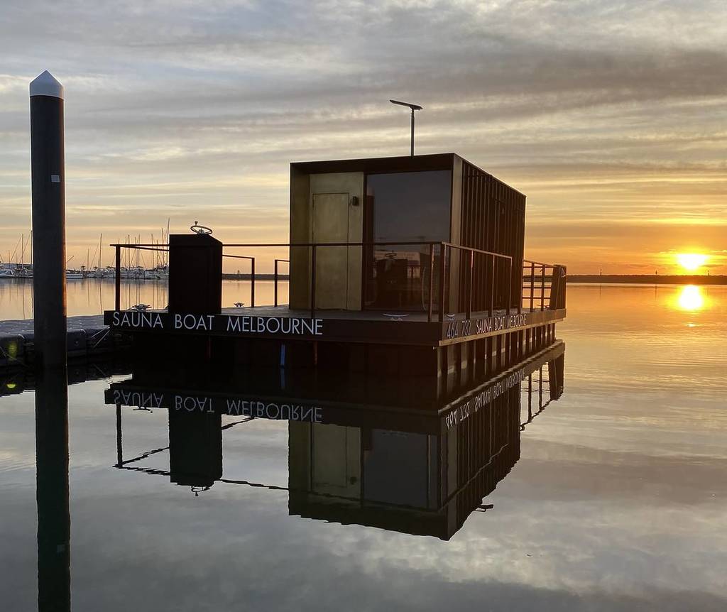 the Sauna Boat in Melbourne floating on the water in Docklands at sunset
