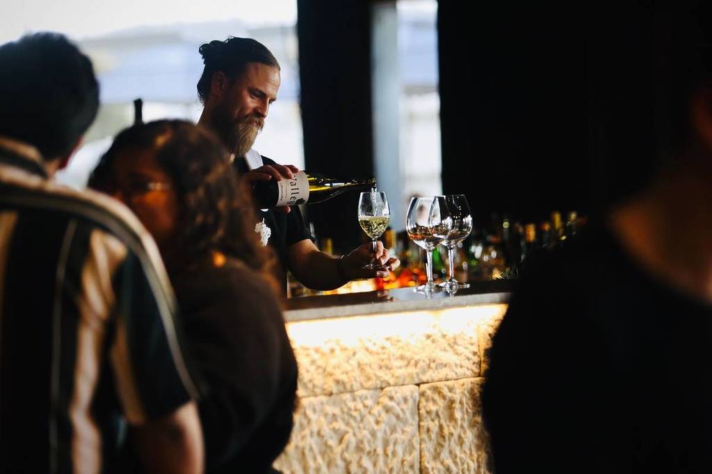 man pouring wine at Jayden Ong Wines