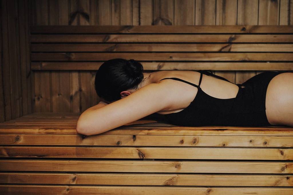 woman lying face down in the sauna on Sauna Boat Melbourne