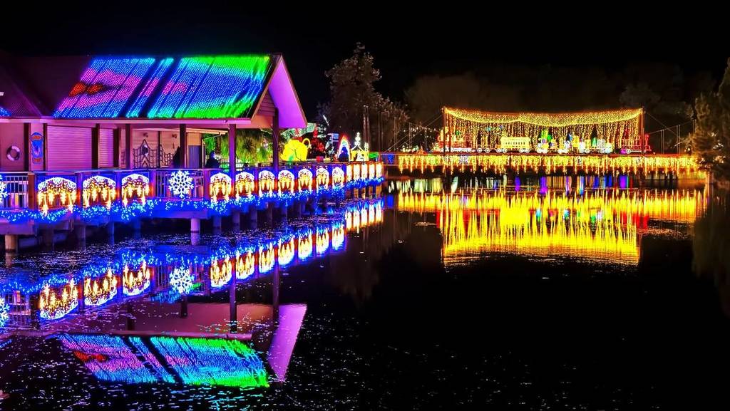 Buildings glowing with lights are seen at Adventure Park's Winter Glow Festival.