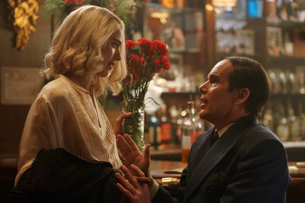 two characters from Blue Moon talking in a bar