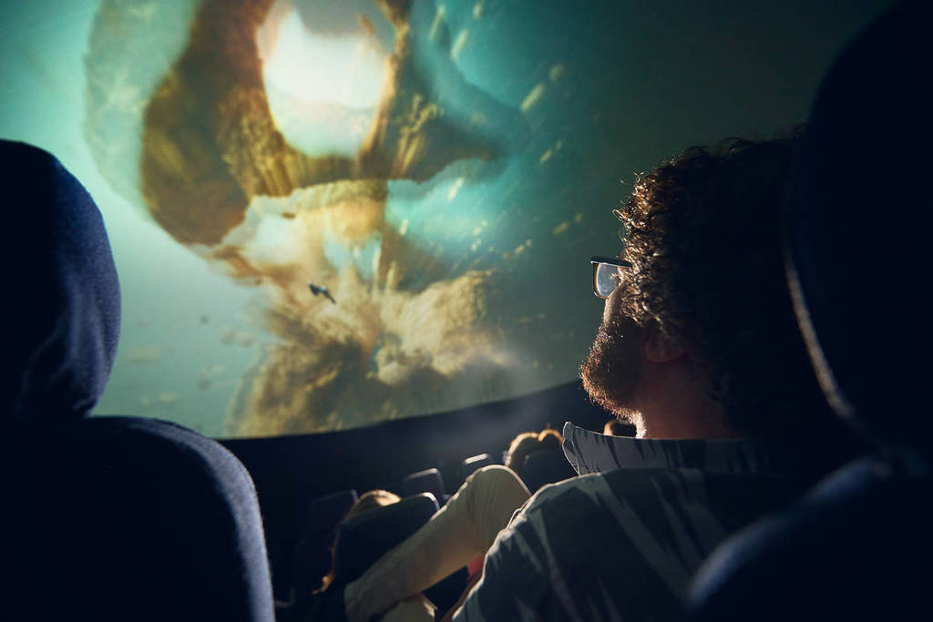 man watching a show at Melbourne Planetarium