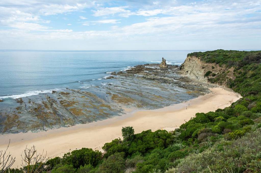 view from high vantage point of The Caves beach