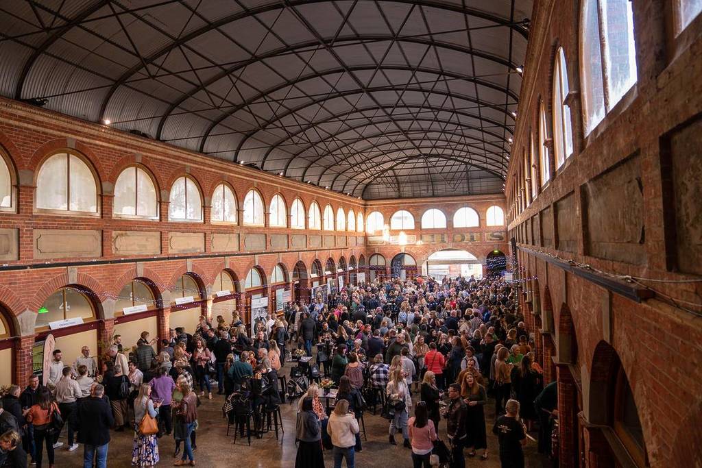 people inside the Ballarat Mining Exchange Building trying wine at the Red Series event