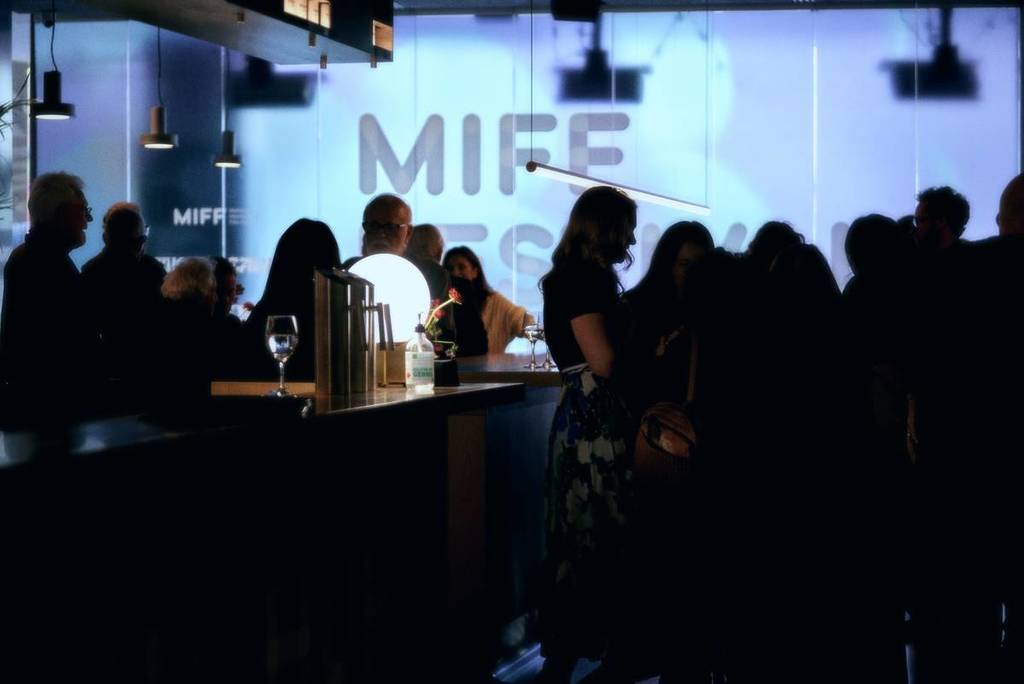 crowds in a bar area during a MIFF event