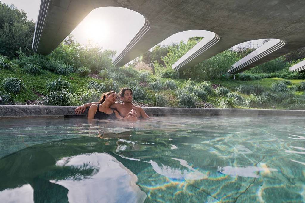 a couple bathing in one of the pools at Alba Thermal Springs and Spa