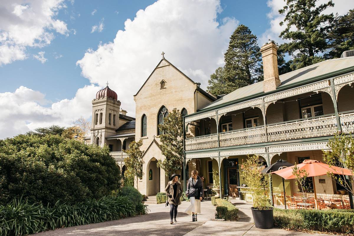 The Convent Gallery in Daylesford, with its historic architecture and visitors enjoying the scenic outdoor surroundings