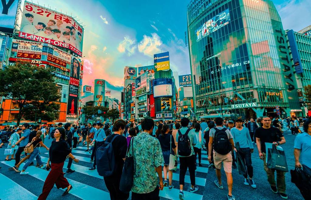 people walking on the famous Shibuya crossing in Tokyo