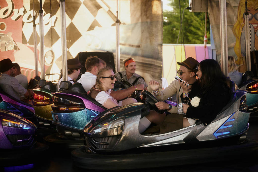 people having fun in bumper cars at Oktoberfest in the Gardens