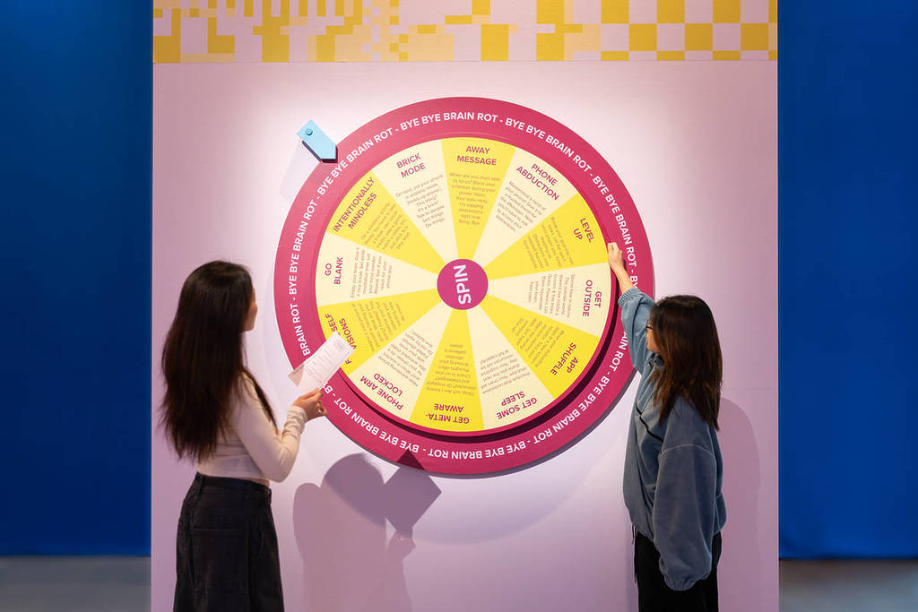 people spinning a wheel at Distraction in Science Gallery Melbourne