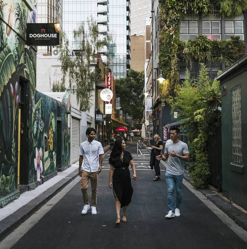 people walking down Meyers Place