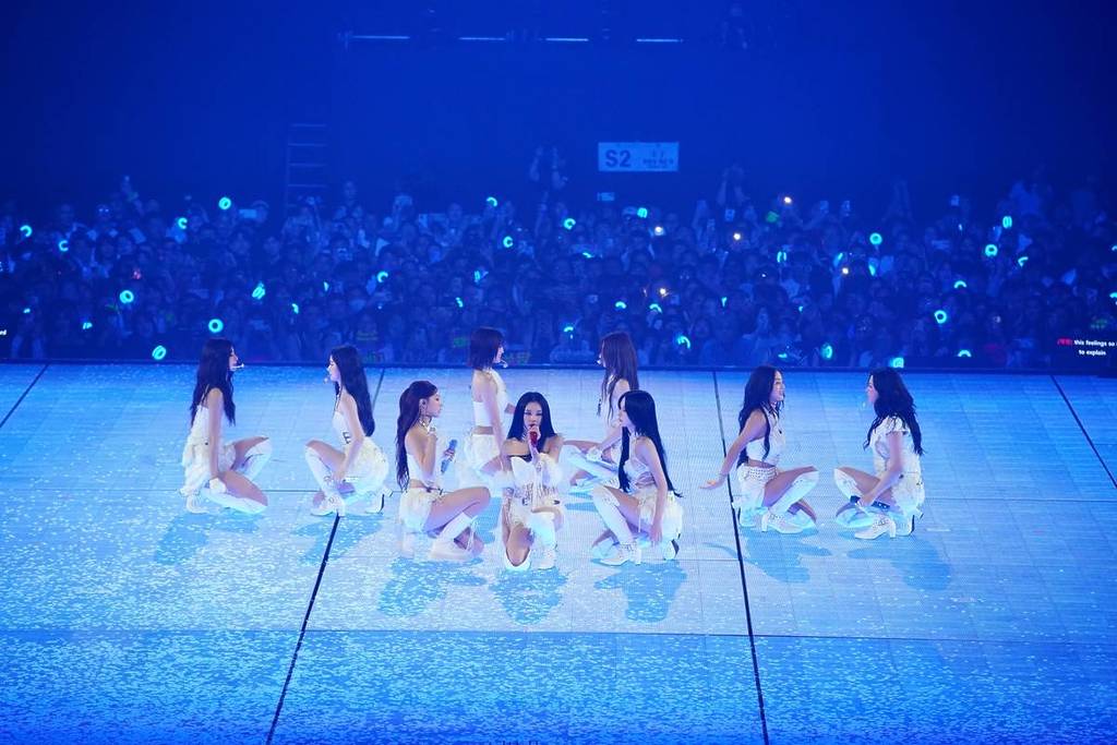 Twice in white on stage in Incheon for the This Is For tour, which is coming to Australia