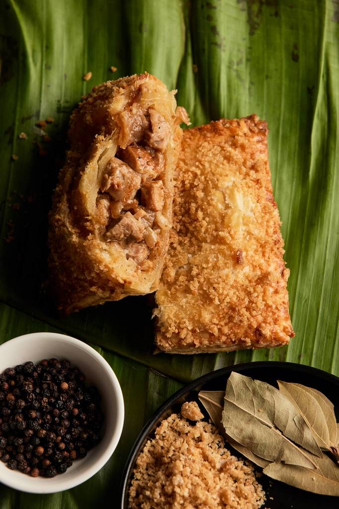 a pork pie with a banana leaf