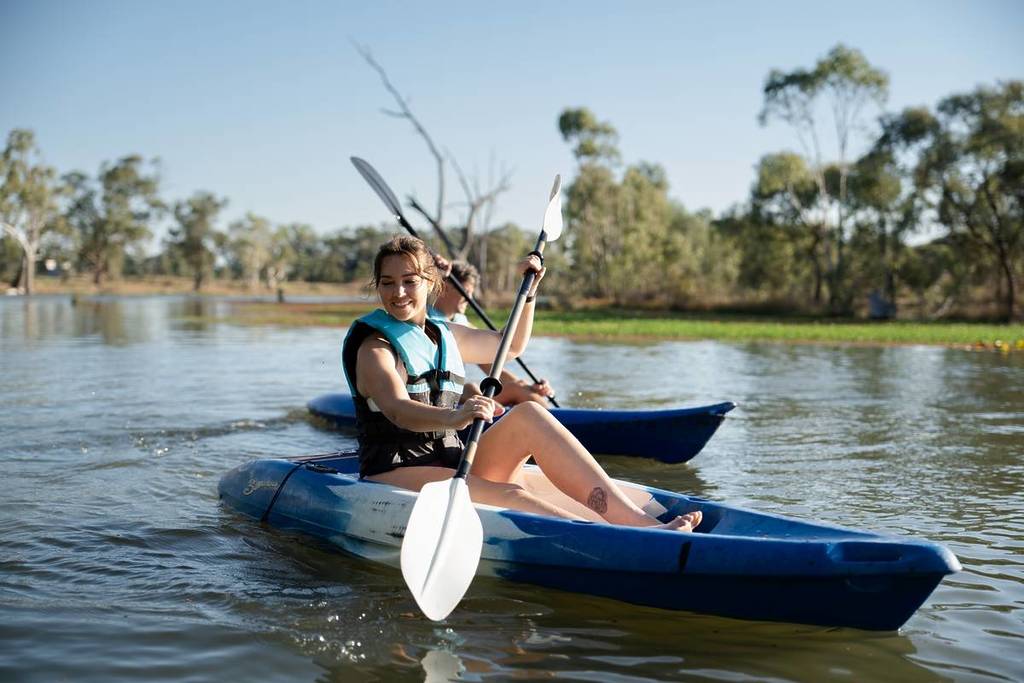 girl smiling while kayaking on Gunbower Creek