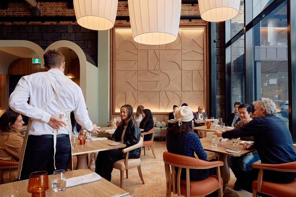 people dining inside North and Common