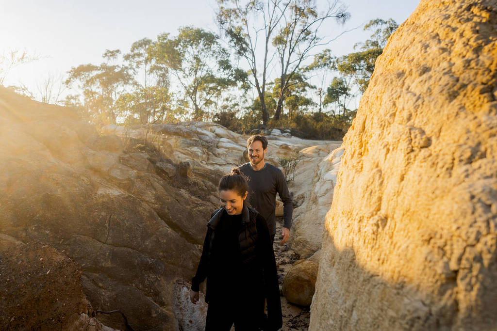 two people walking among the rocks in the pink cliffs reserve