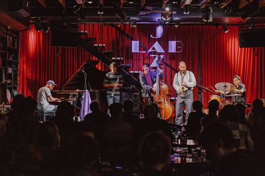 a band performing on stage at the Jazz Lab