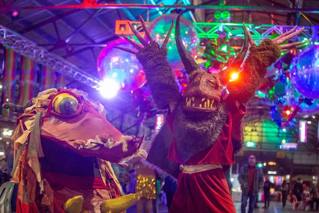roving performers dressed as strange creatures at Fringe Flavours Night Market