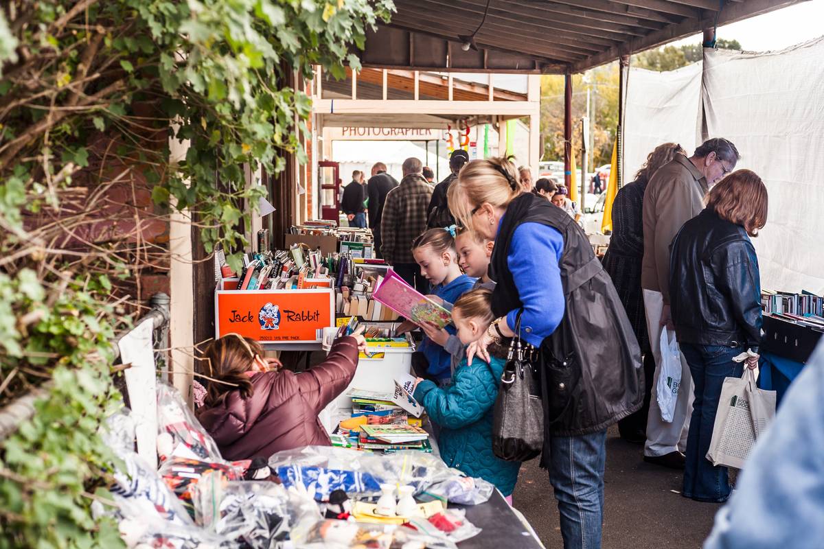 Visitors browsing second-hand books outside a stall at the Clunes Booktown Festival