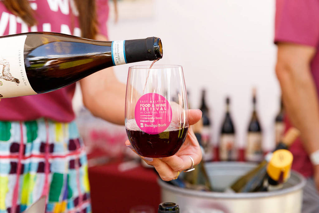 person pouring wine into tasting glass for East Malvern Food & Wine Festival