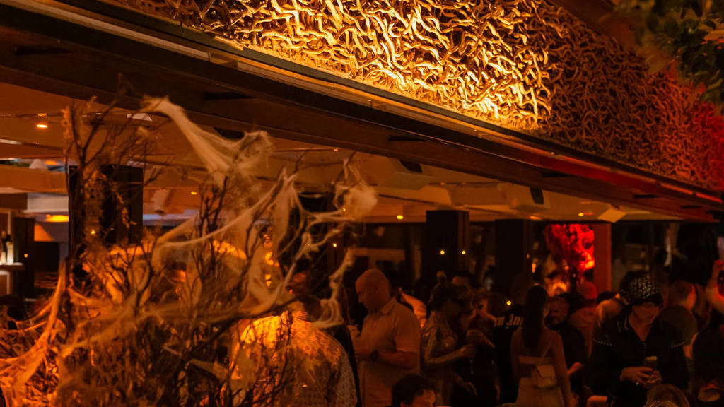 fake spider web on a tree as part of Halloween decorations inside the lobby of 1 Hotel Melbourne