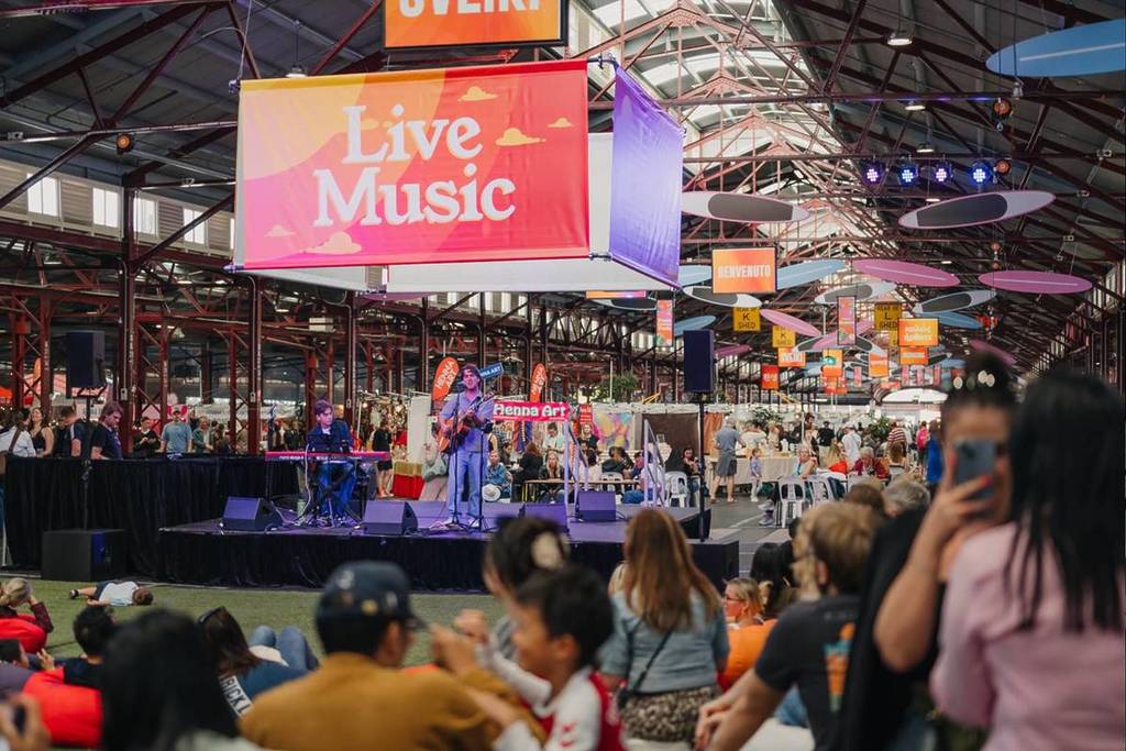 people listening to live music at Queen Victoria Market