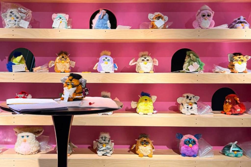 Furby toys lined up on shelves as part of the FRIEND exhibition at National Communication Museum