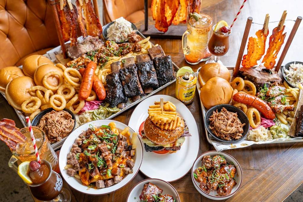 a selection of BBQ meats, burgers and more food from Third Wave as well as Moon Dog drinks