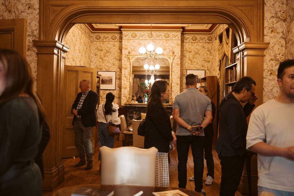 people exploring what might be a lounge room or library at Tasma Terrace