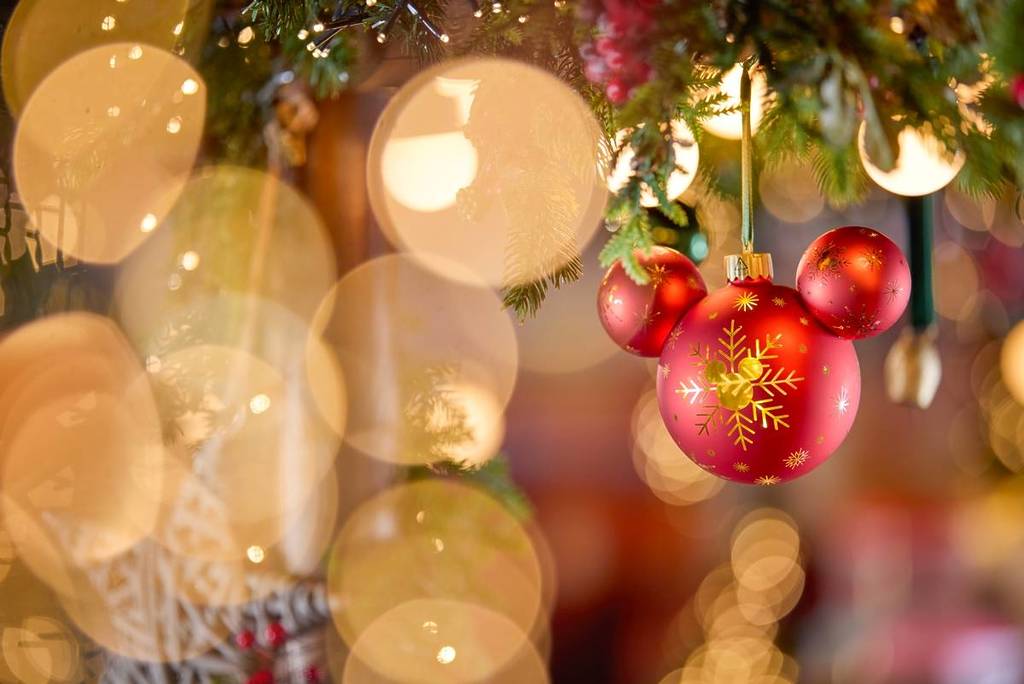 a red Mickey Mouse shaped ornament from the Disney Store Pop Up