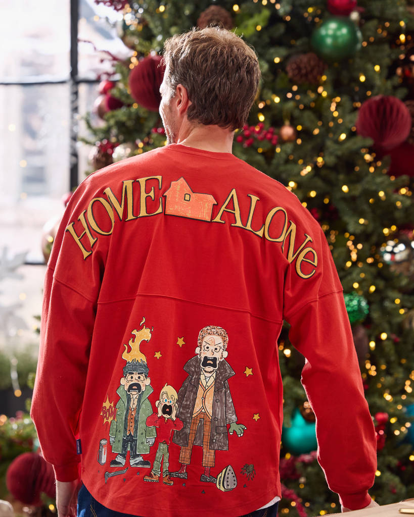 man wearing a red long sleeve shirt with a Home Alone design on the back