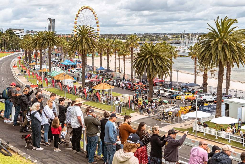 people looking over the race track at the Geelong Revival Motoring Festival