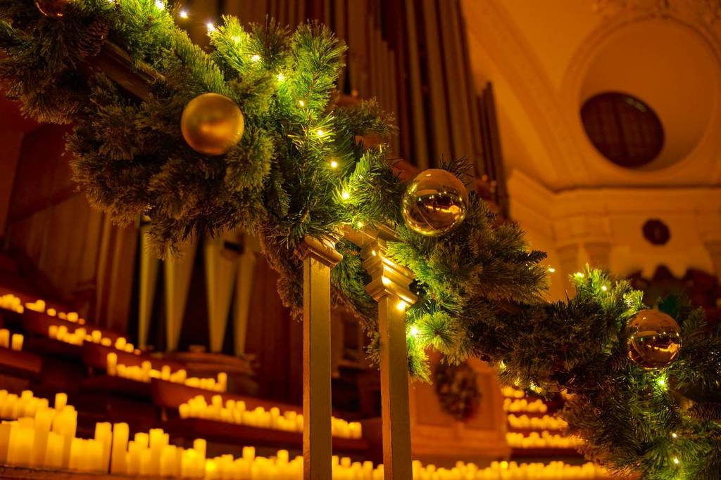 Christmas baubles and a sea of candles during a Candlelight holiday concert