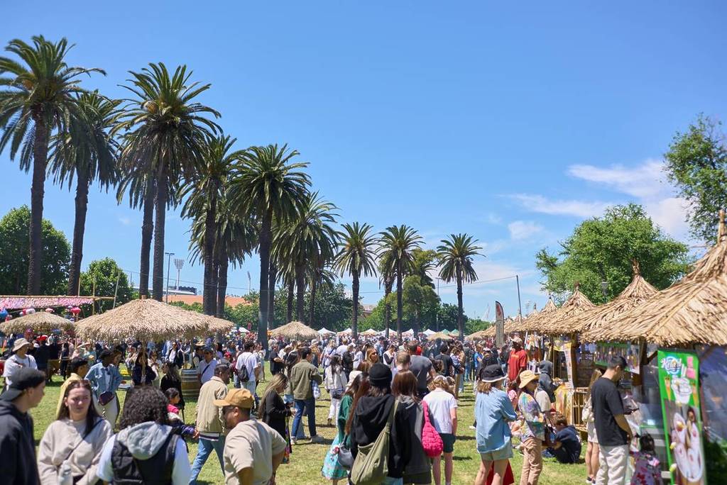 people walking around the huts at the Asia Street Food Festival by the Yarra