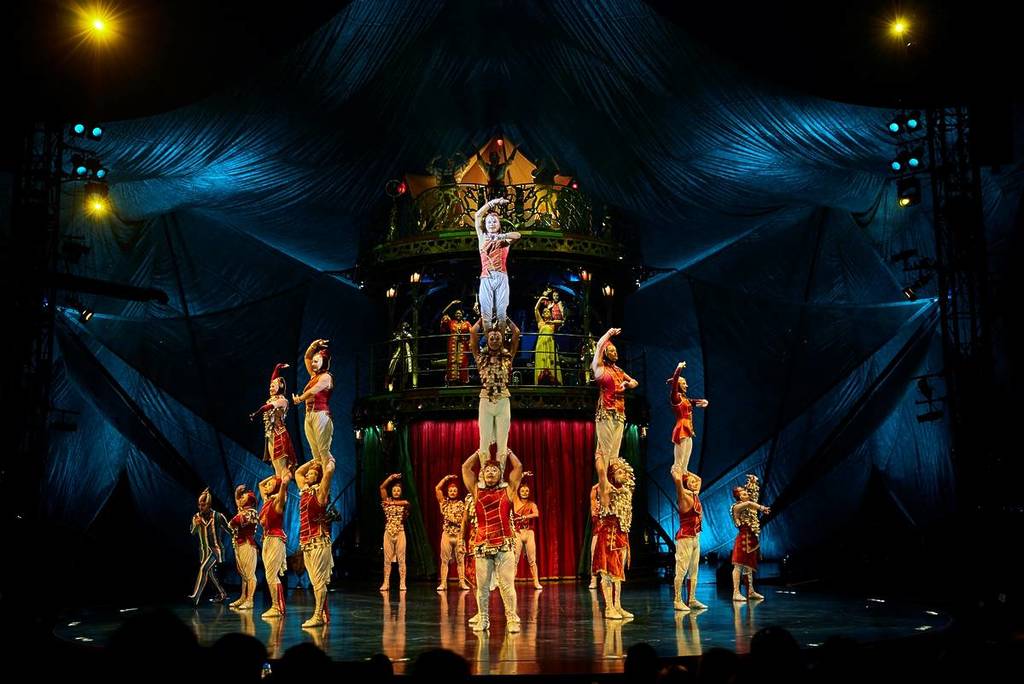 performers standing on each others shoulders at KOOZA by Cirque du Soleil