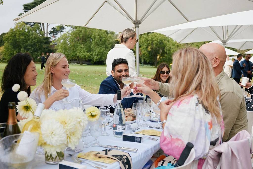people dining at the world's longest lunch outdoors