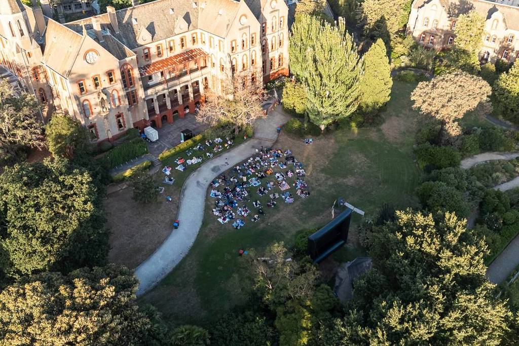 aerial view of people watching a movie on the lawn at Abbotsford Convent