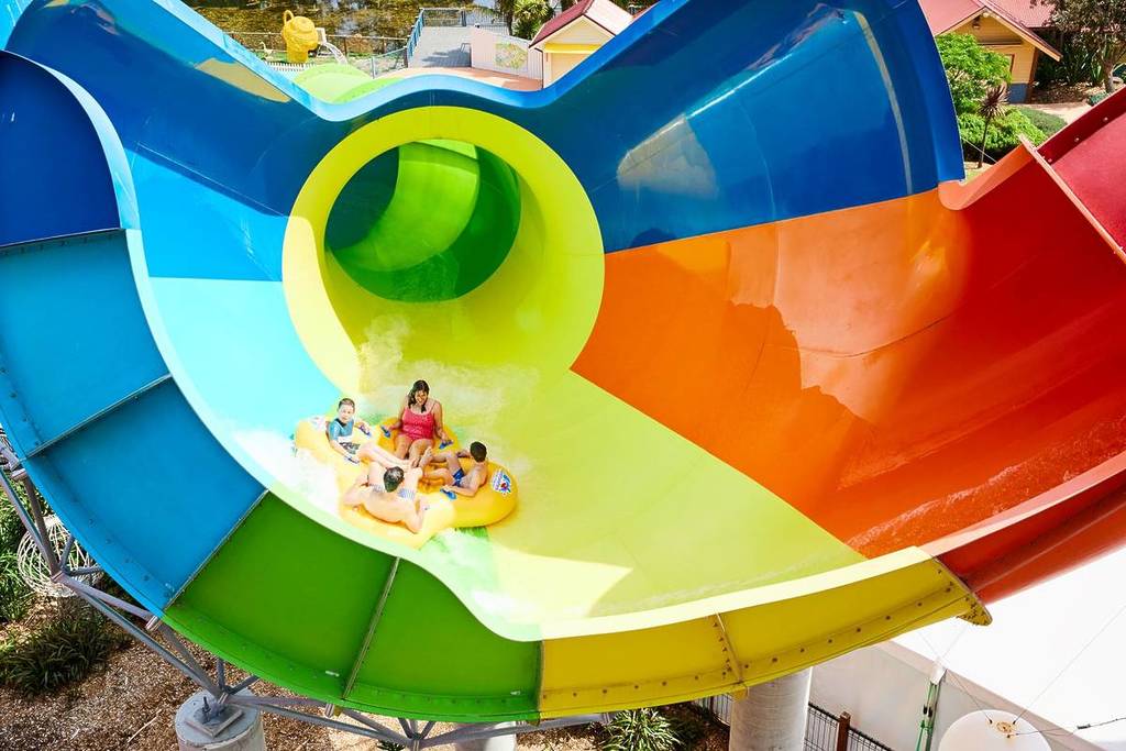 people riding down a funnel waterslide at Adventure Park