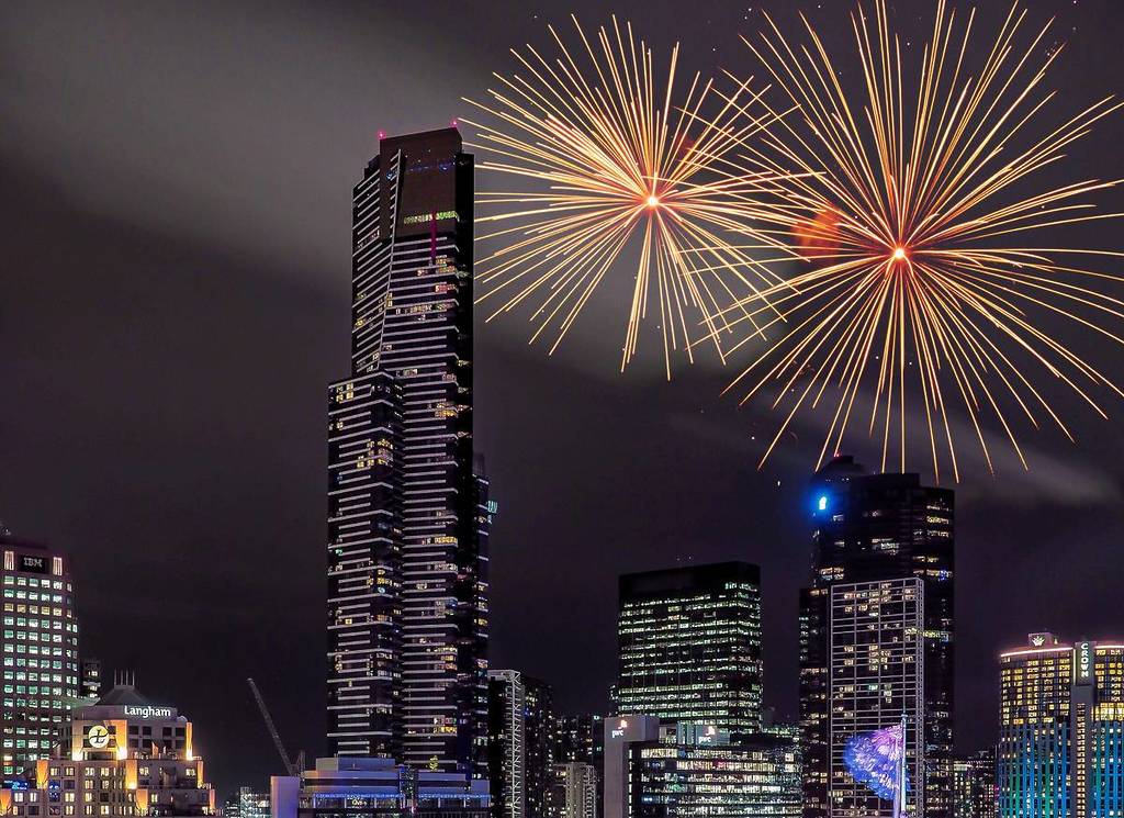 view of Melbourne Skydeck or Eureka Tower with fireworks going off for New Year's Eve