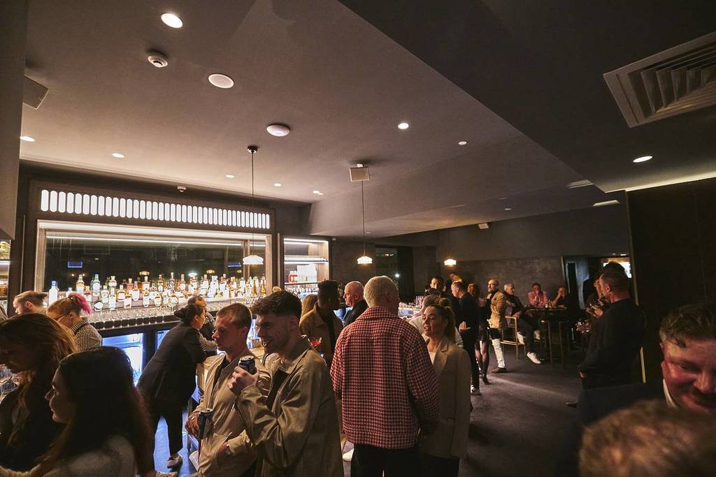 people standing around during a cocktail party at Blackbird