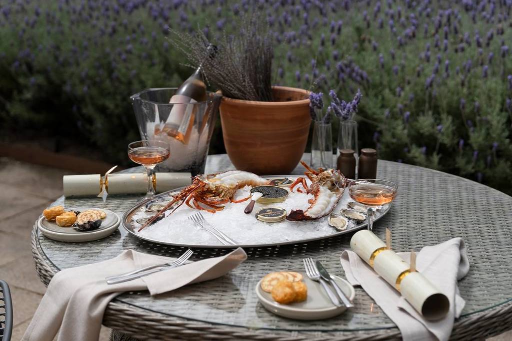seafood, alcohol in glasses and Christmas crackers on a table at the Dining Room of Lancemore Lindenderry Red Hill