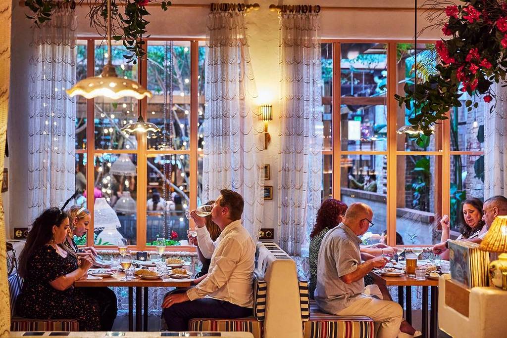 people dining at Tippy Tay by the window