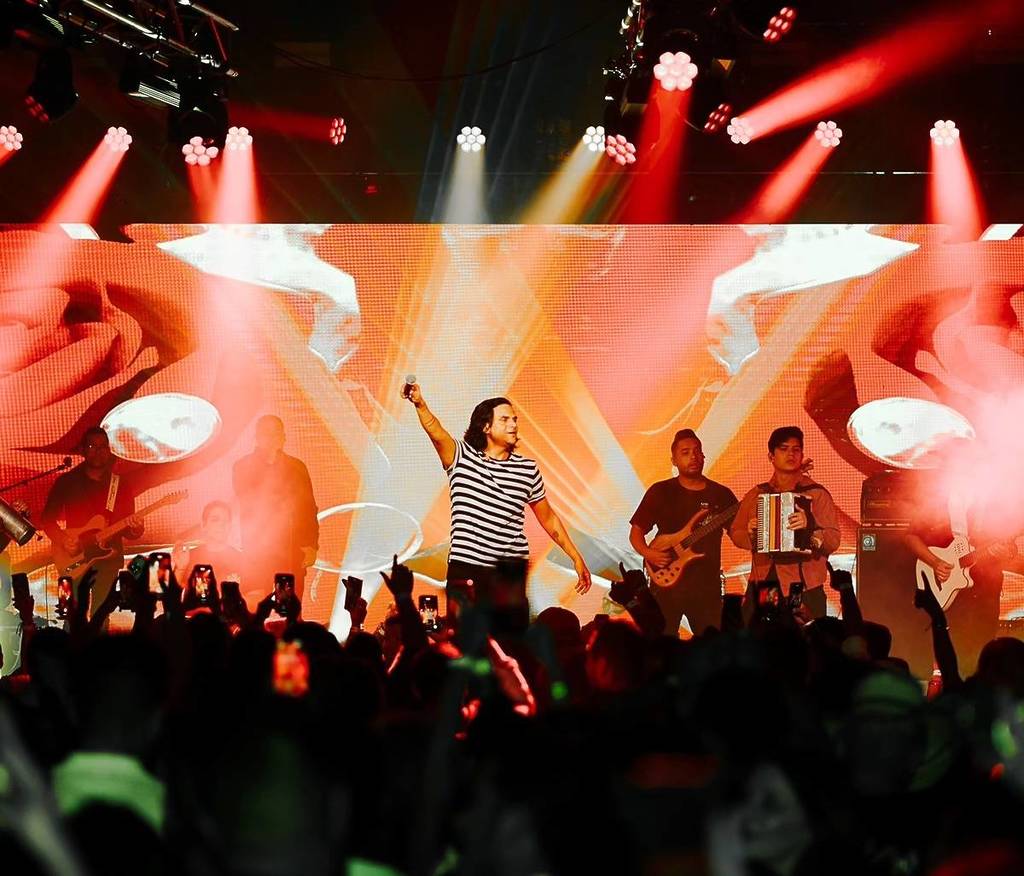man performing in front of crowd