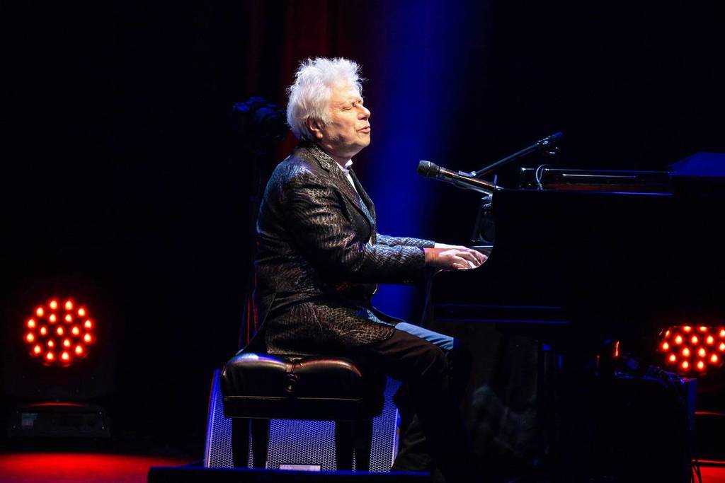 Alan Menken playing the piano