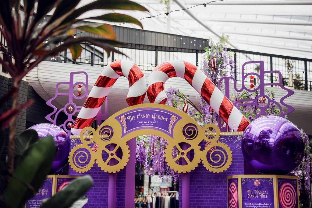 entrance to photo installation at Docklands with candy canes, wisteria trees and more